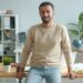 business-person-desk-workspace-unsplash - LONDONwebzine A focused entrepreneur working at a co-working desk in a modern London flexible workspace