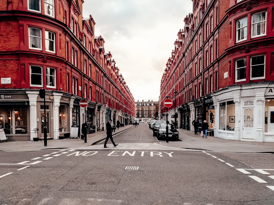 A property professional walks through a regenerating London neighbourhood, assessing London property potential.