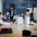 business-pitch-meeting-unsplash - LONDONwebzine An early-stage founder presents her business plan to investors inside a City of fintech accelerators programme boardroom.