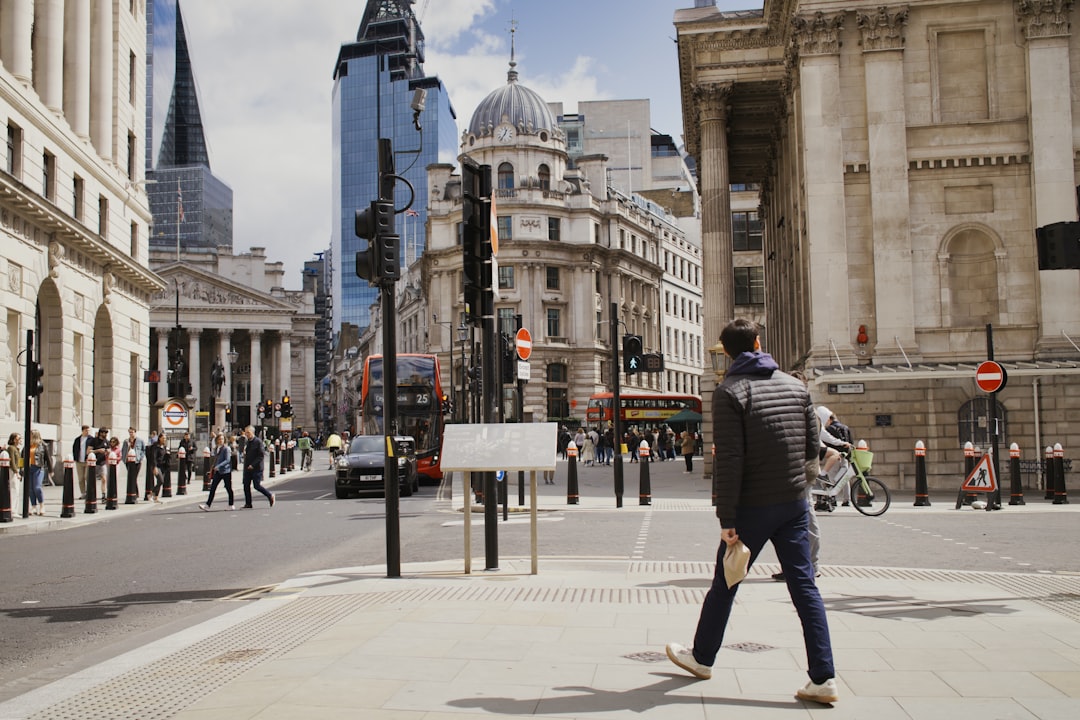 A business professional walks through the City of London after completing limited company registration for their new venture