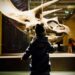 children-museum-fossils-unsplash - LONDONwebzine A young child reaches toward a fossil display during a rainy day London museum visit at the Natural History Museum