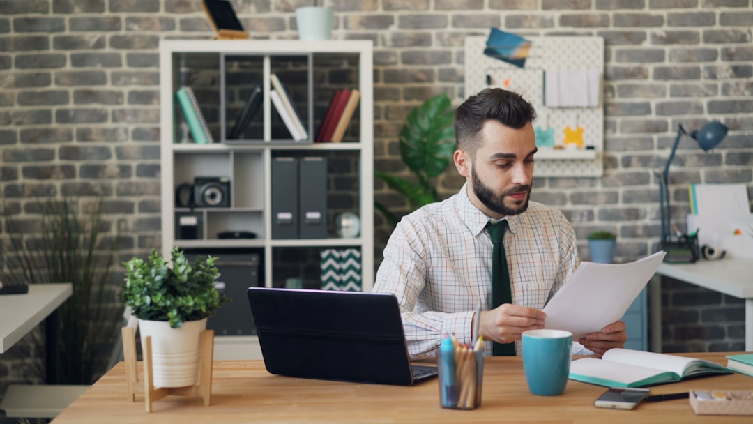 A London entrepreneur reviews Companies House requirements on a laptop as part of limited company registration