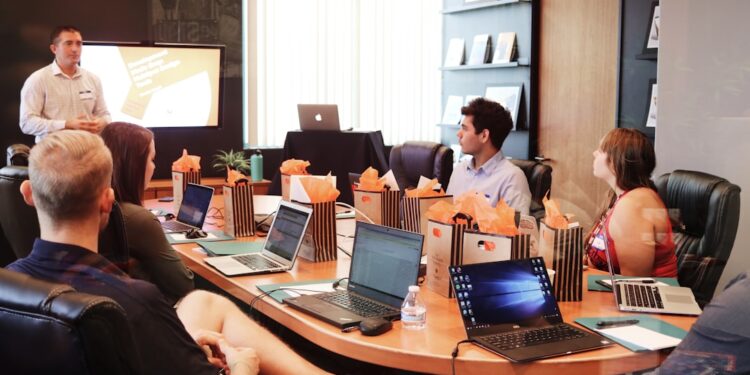 founder-meeting-investor-unsplash - LONDONwebzine A first-time founder presenting his startup pitch to a venture capital investor in a London office