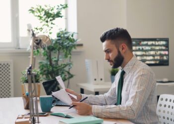 A first-time founder signs incorporation documents during the limited company registration process in London