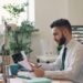 founder-signing-business-documents-desk-unsplash - LONDONwebzine A first-time founder signs incorporation documents during the limited company registration process in London