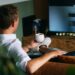 man-watching-golf-pub-tv-unsplash - LONDONwebzine A London golf fan watching the Open Championship leaderboard on a pub screen in the city