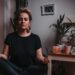 woman-breathing-meditation-studio-floor-unsplash - LONDONwebzine A woman practising conscious breathing in one of London's leading breathwork studios, lying on a mat in a softly lit room.