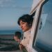 woman-in-car-window-seaside-unsplash - LONDONwebzine A woman looks out of a car window as she travels toward one of the coastal escapes from London on a bright summer afternoon.