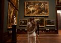 woman-museum-gallery-unsplash - LONDONwebzine A visitor examines an immersive installation at the London Design Biennale inside Somerset House, London.