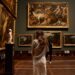 woman-museum-gallery-unsplash - LONDONwebzine A visitor examines an immersive installation at the London Design Biennale inside Somerset House, London.