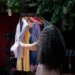 woman-shopping-in-linen-outfit-shop-unsplash - LONDONwebzine A woman in a linen outfit browsing an independent stall at a London market, building her sustainable wardrobe.