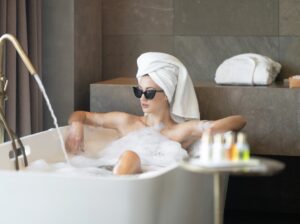 A woman resting beside the hydrotherapy pool at one of London's most exclusive private spas, eyes closed in silence