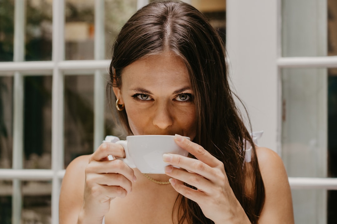 A customer samples freshly roasted beans at a London coffee roasters open-day event, exploring single-origin flavor profiles.