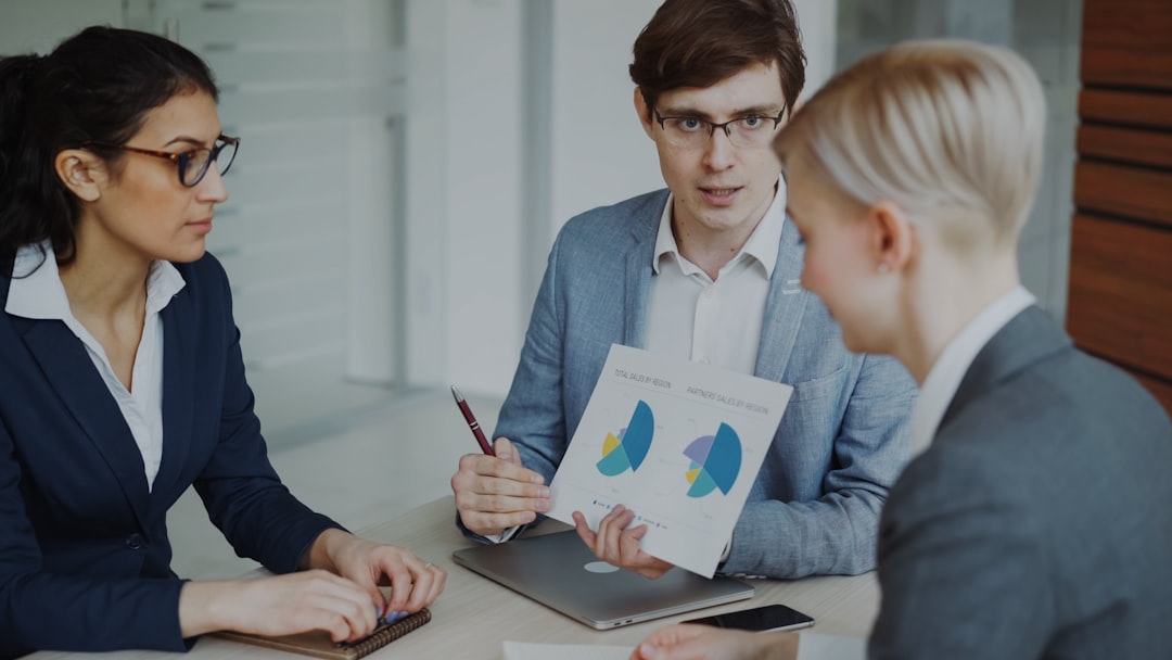 A business audit team reviews cash flow charts together in a London boardroom ahead of the fourth quarter.