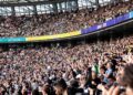 cricket-fan-crowd-stadium-unsplash - LONDONwebzine Diverse fans in the stands at The Oval experiencing the cricket economy of a live England Test match in south London