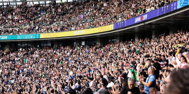 cricket-fan-crowd-stadium-unsplash - LONDONwebzine Diverse fans in the stands at The Oval experiencing the cricket economy of a live England Test match in south London