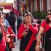 desi-woman-celebrating-street-unsplash - LONDONwebzine A South Asian woman in traditional dress celebrates Independence Day at a community event in London