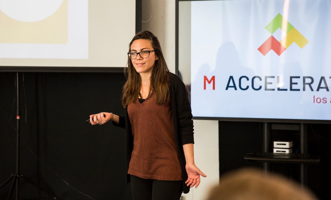 An entrepreneur presents her pitch deck to a panel during a London accelerator selection event