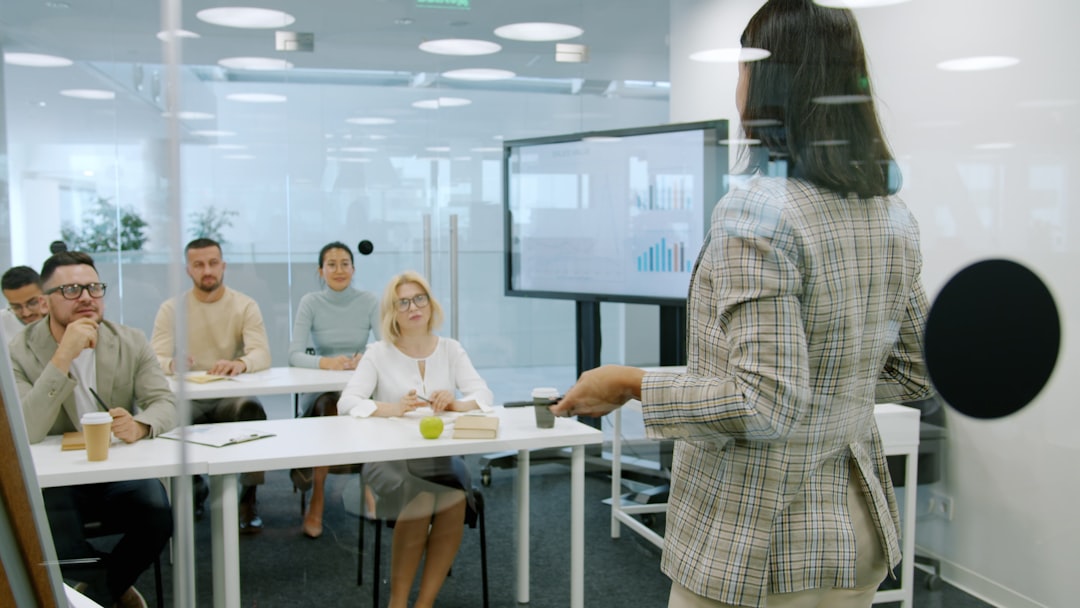A London entrepreneur presents her pre-launch product to a business mentor in a modern boardroom