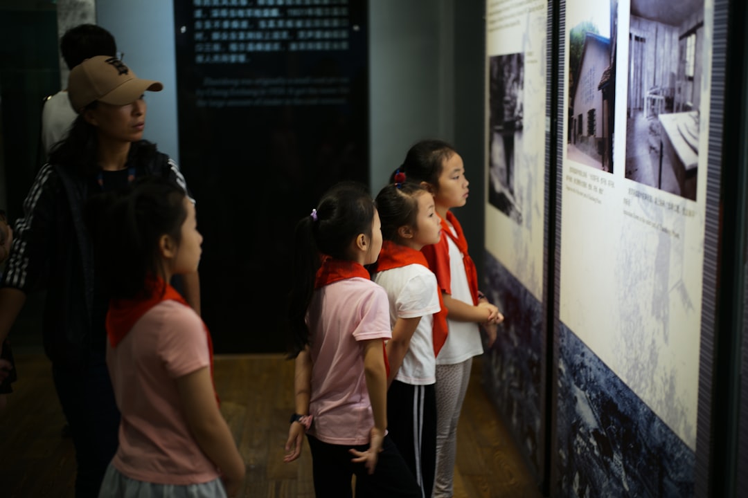 A family with young children walks through the galleries of a free venue in London, discovering exhibits about the past.