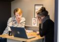 london-accountant-reviewing-documents-desk-unsplash - LONDONwebzine A London finance director conducts a business audit at her office desk in the City, reviewing financial records before Q4.