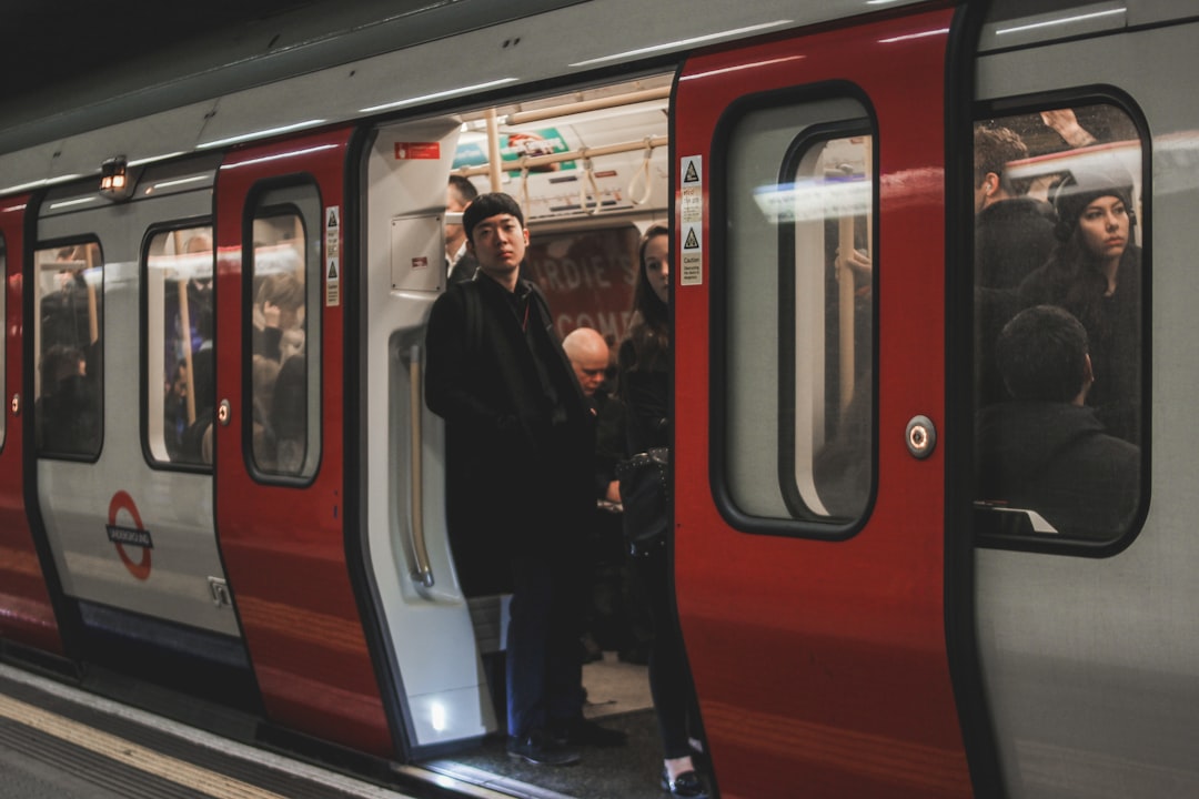 A business traveler on a DLR carriage, using the fastest transport link between London airports and the city center.