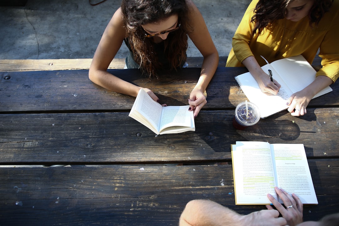 A group of readers gathered at an evening event inside an independent bookshop in London