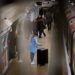 woman-boarding-eurostar-train-london-unsplash - LONDONwebzine A smiling woman boarding a Eurostar train at St Pancras International, ready for one of the best city breaks from London