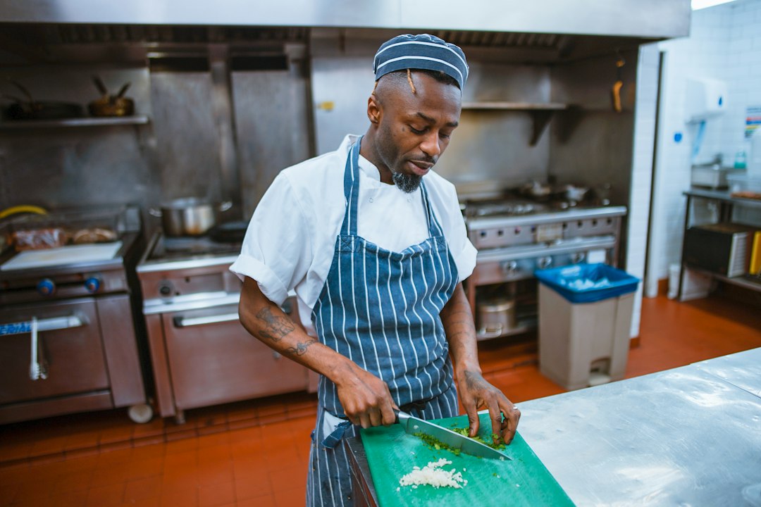 A chef serving a traditional wot dish at one of London's Ethiopian restaurants