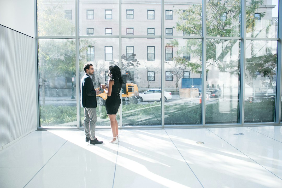 Two investors inspect a commercial property lot listed for commercial auctions in the City of London