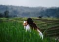 A London traveller exploring rice terraces in Bali, one of the most popular long-haul destinations for Londoners in autumn