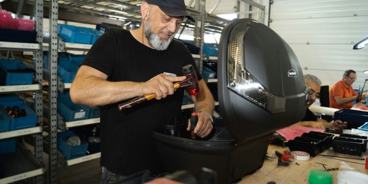 Repair cafes in London fix dont bin photo 1 - LONDONwebzine Volunteer fixer at a London repair cafes session mending a small appliance